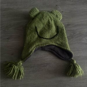 green knit beanie with pom pom